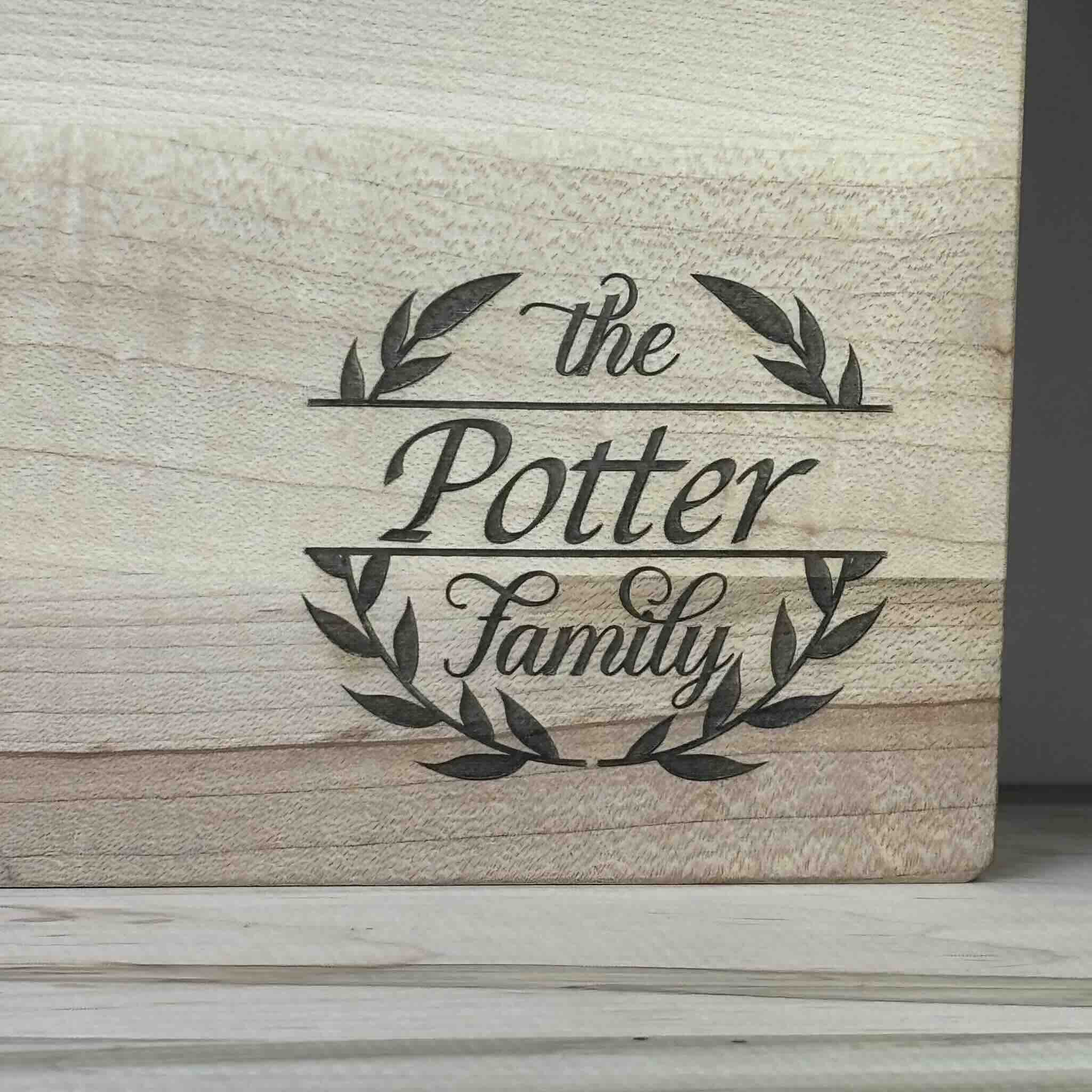 Custom cutting board engraved with The Potter Family