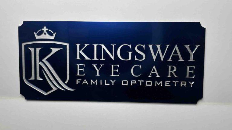 Kingsway Eyecare Family Optometry sign with logo and crown in silver on blue