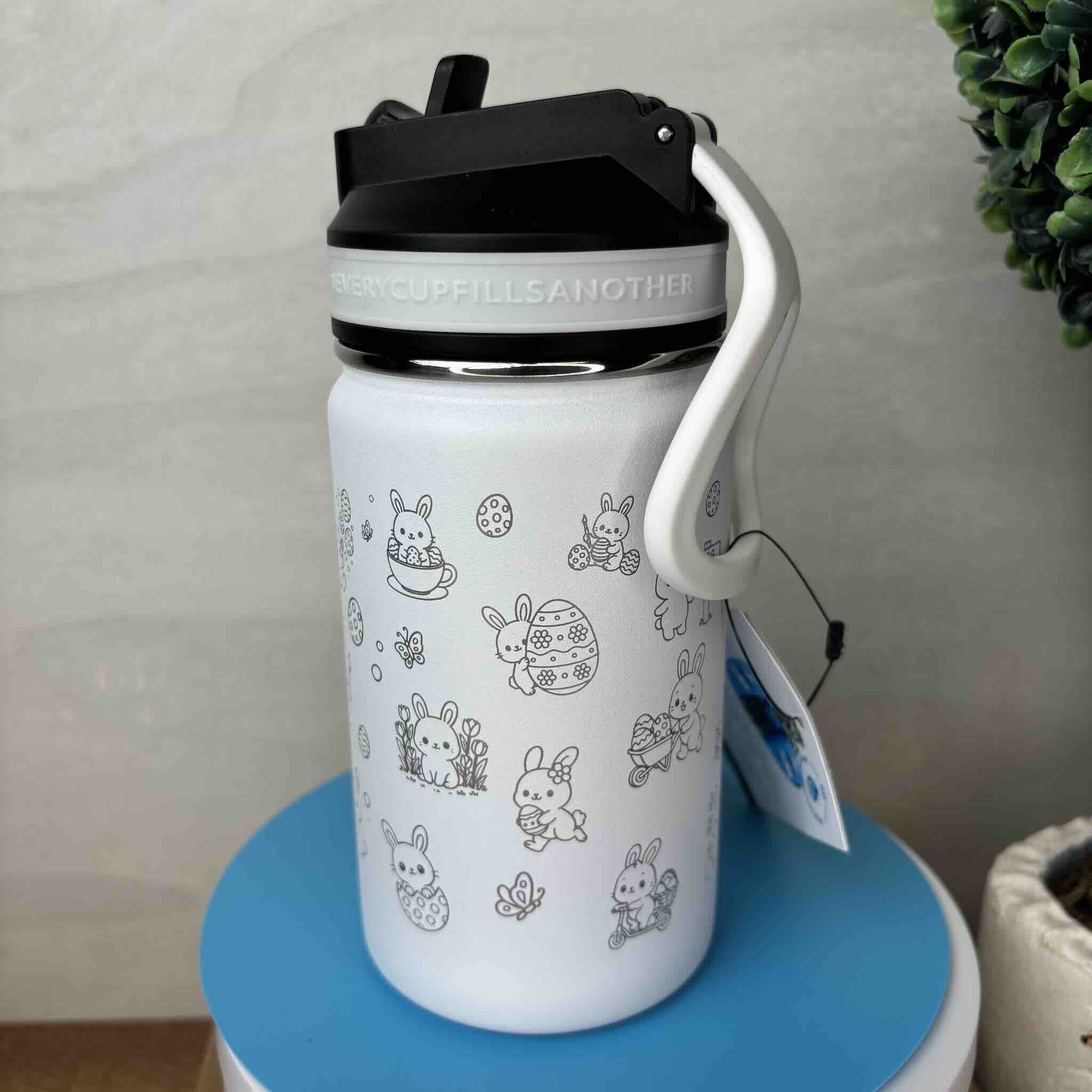 White water bottle with cute bunny illustrations and black lid