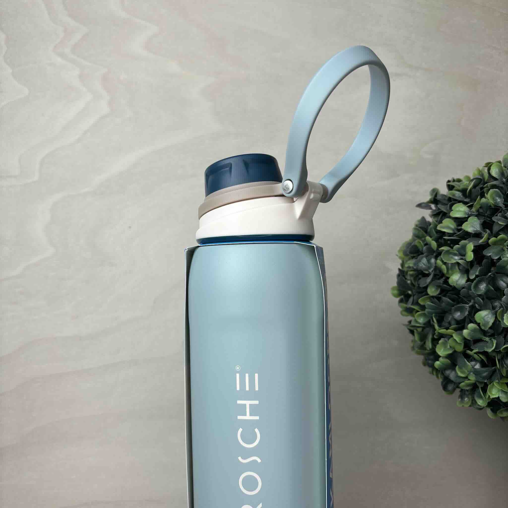 Stylish reusable water bottle with handle and semantic engraving